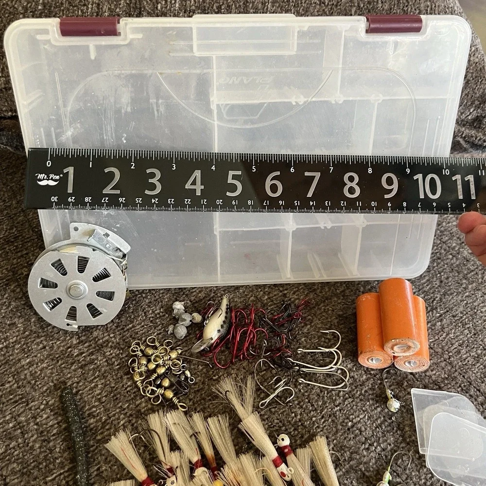 Plano Tackle Box Lot with Rebel Lure Bucktail Jigs Hooks Swivels and Hand Reel